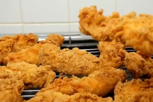 Crispy homemade chicken tenders recipe with golden crunchy coating served fresh on a wire rack
