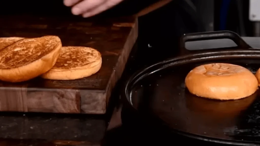 Toasted burger buns being prepared for a homemade McChicken Burger Recipe