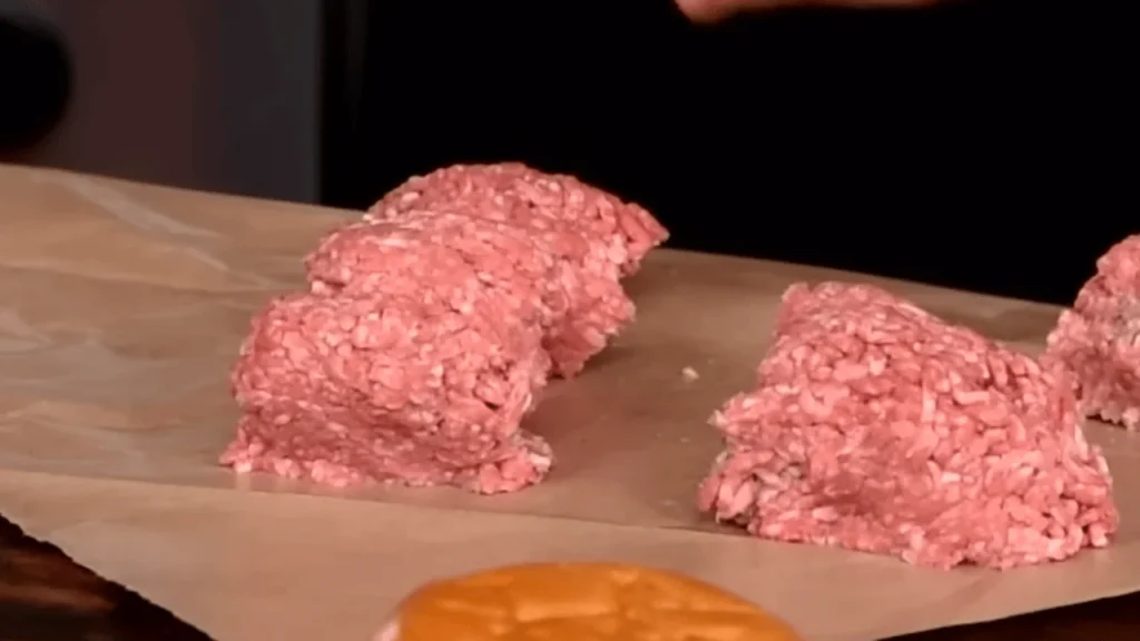Raw chicken patties shaped and ready for frying in a homemade McChicken Burger Recipe