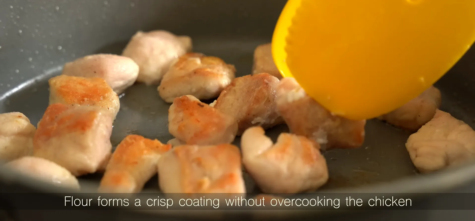 Pan-searing flour-coated chicken pieces to achieve a golden brown crispy crust in a skillet