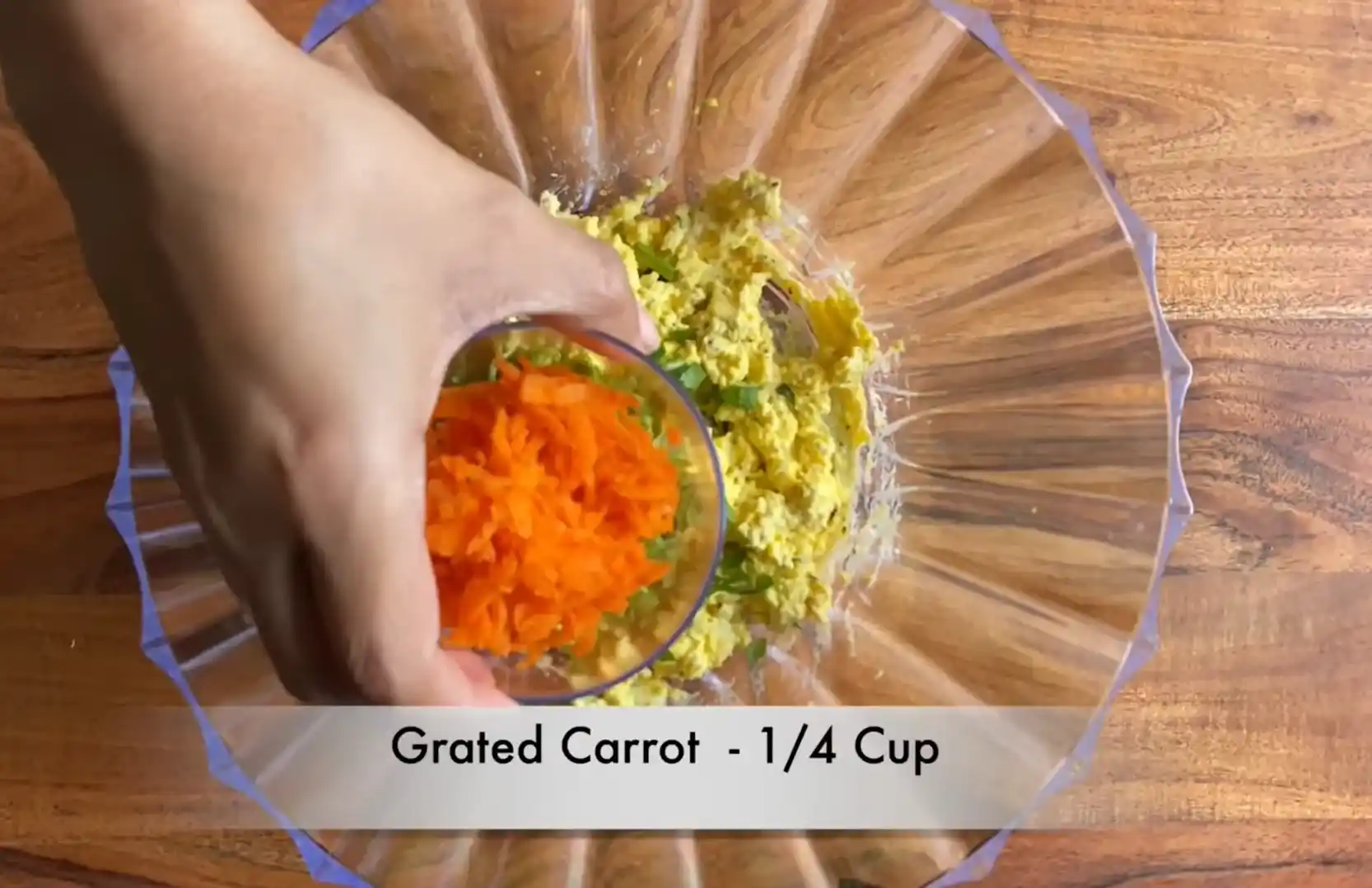 Adding 1/4 cup finely grated orange carrots to egg salad mixture