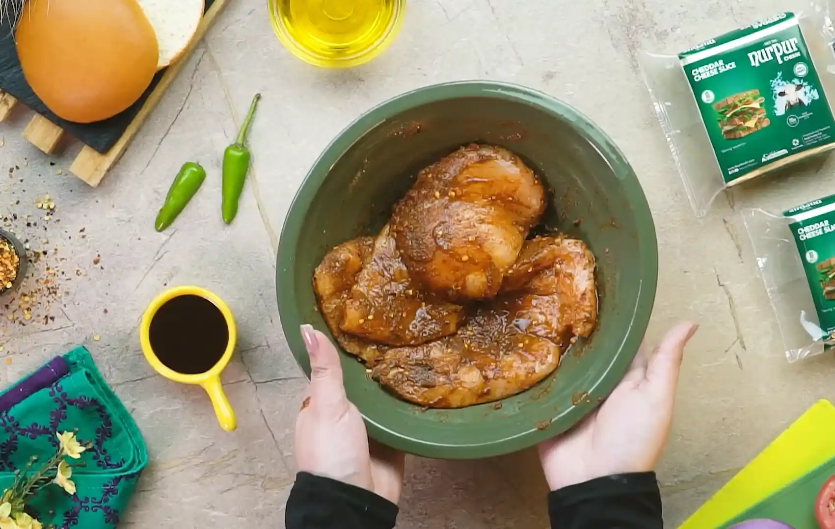 Chicken breasts marinating in BBQ sauce for burger recipe