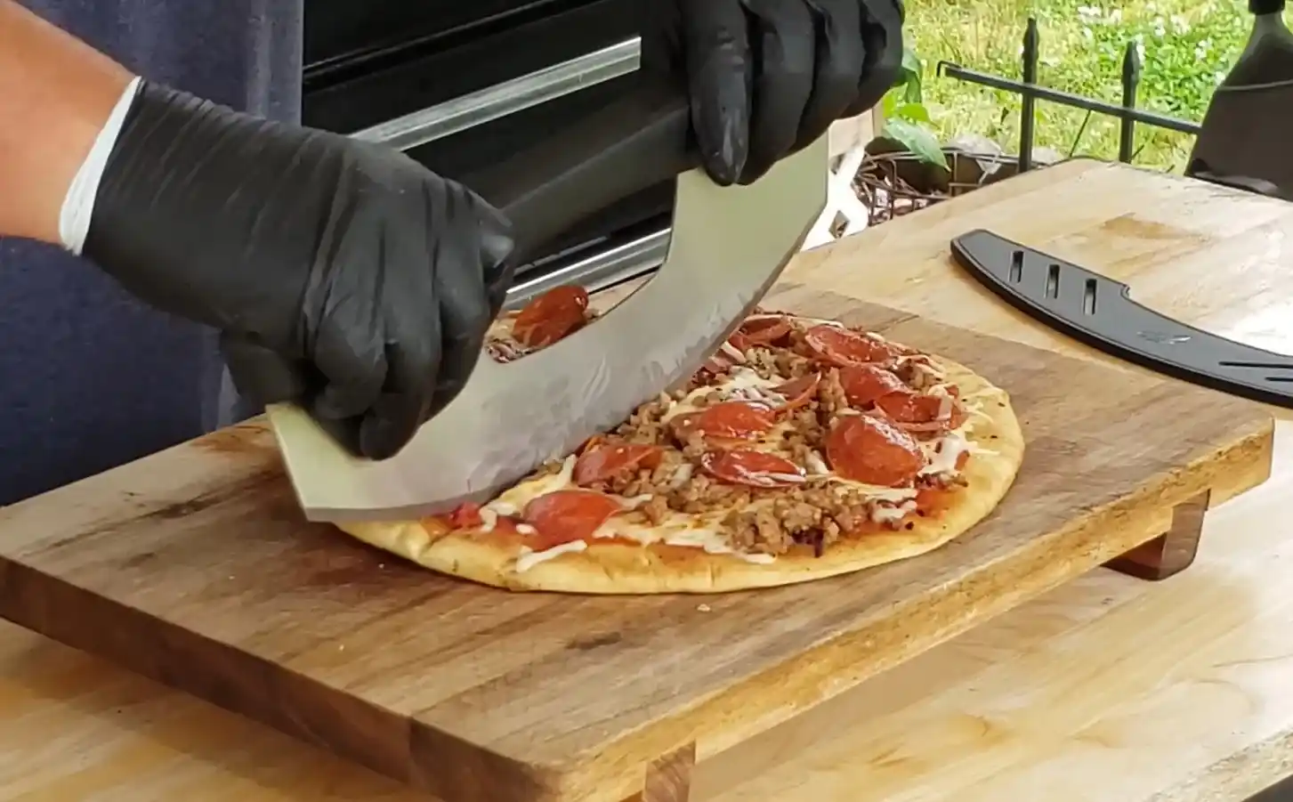 Cooking crispy pizza on Blackstone outdoor griddle