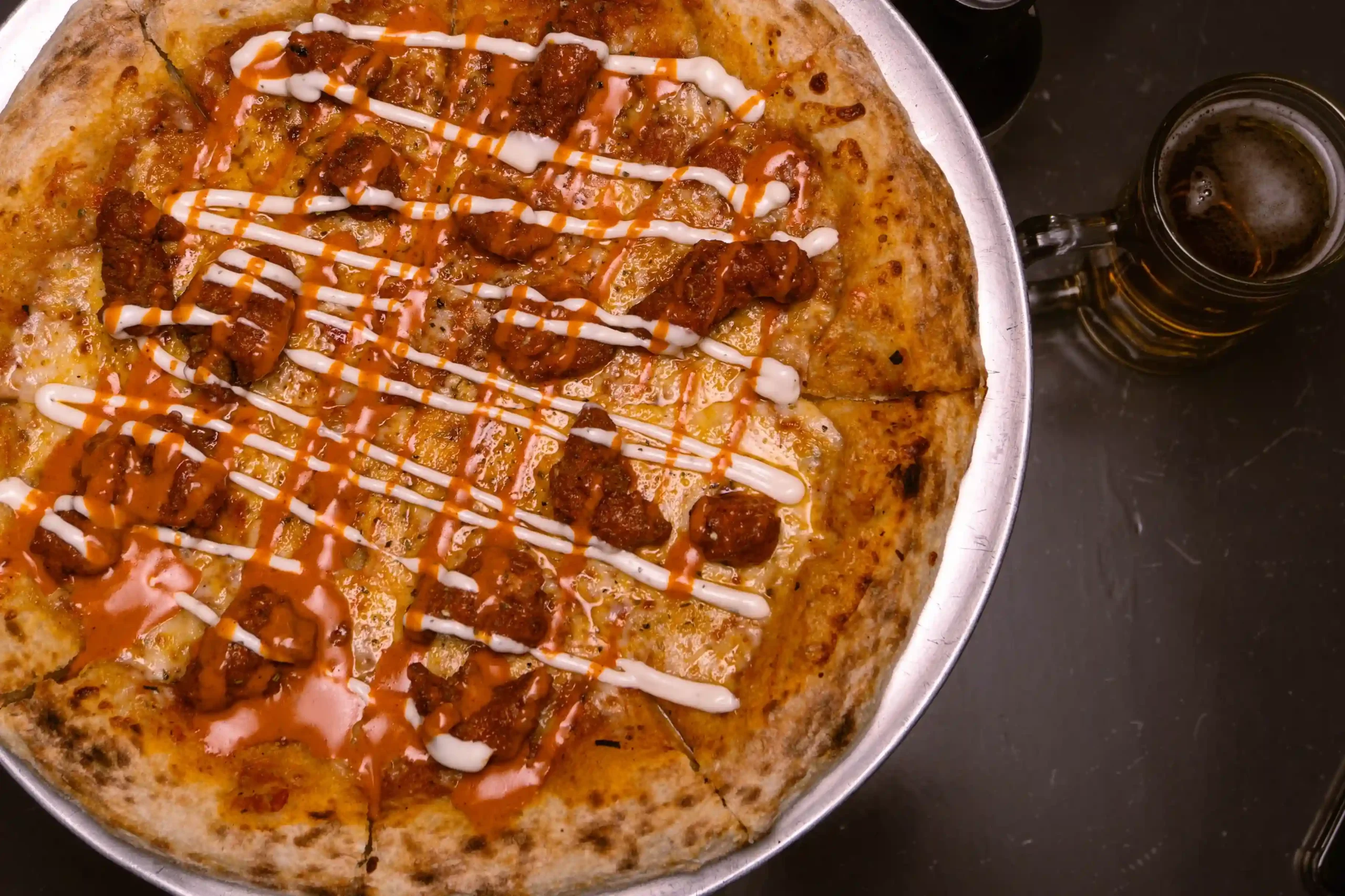 Spicy chicken wing pizza recipe with buffalo sauce
