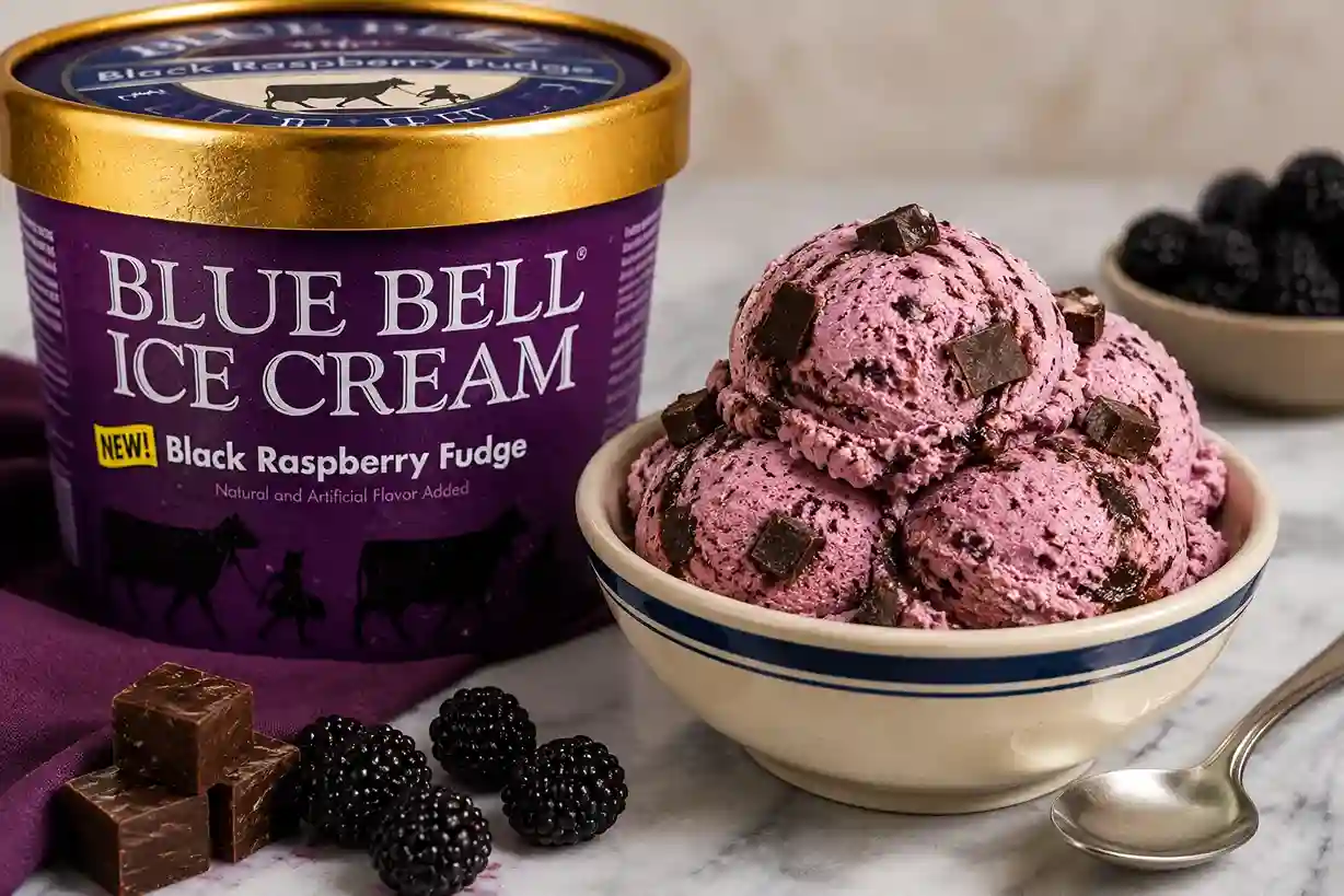 Gourmet bowl of copycat Blue Bell Black Raspberry Fudge ice cream topped with chocolate shavings and fresh berries