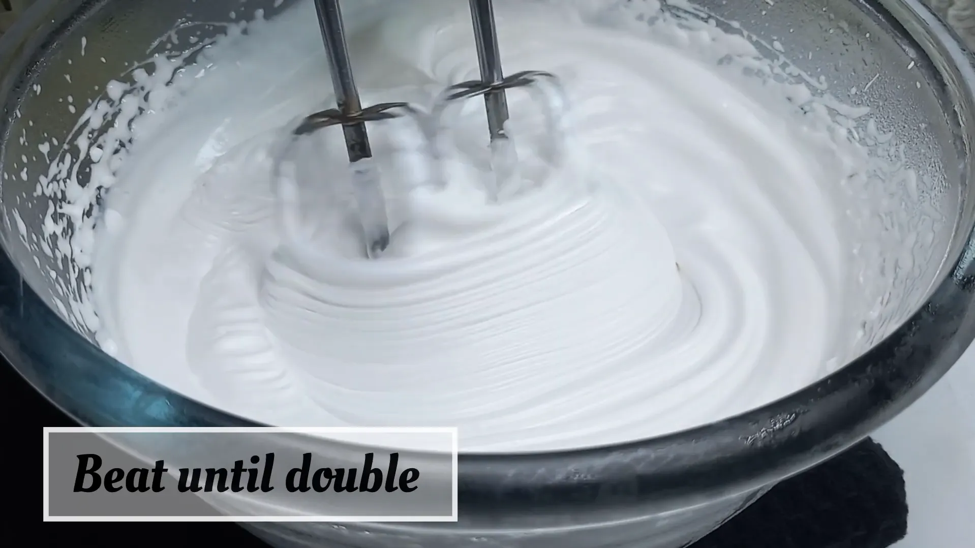 Heavy whipping cream beaten with electric hand mixer until doubled in volume