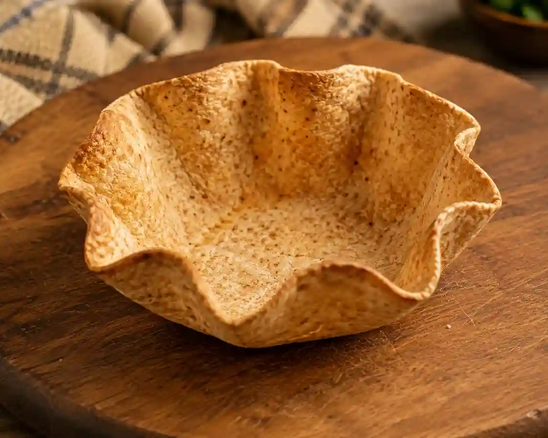 Homemade baked crispy whole wheat tortilla taco bowl shell