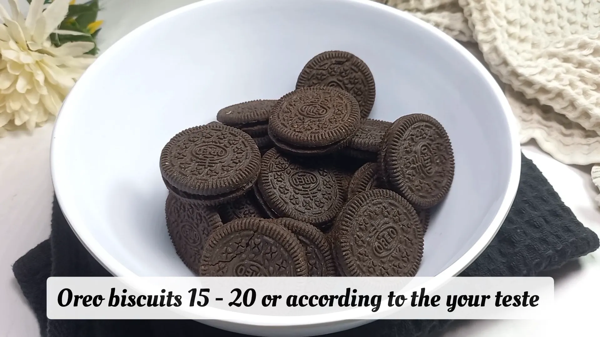 White bowl filled with 15 to 20 whole Oreo biscuits for homemade ice cream recipe
