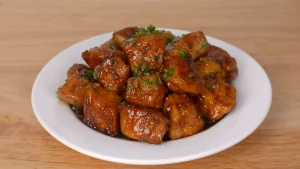 10 minute dinner recipe garlic soy glazed chicken bites on white plate
