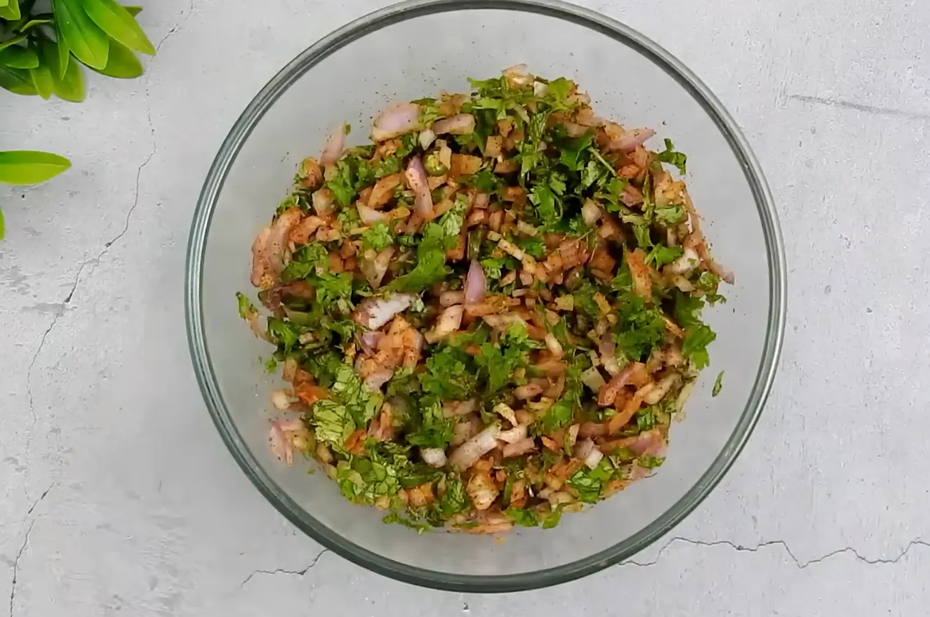 Bowl of finely chopped onions, green chilies, cilantro, and spices